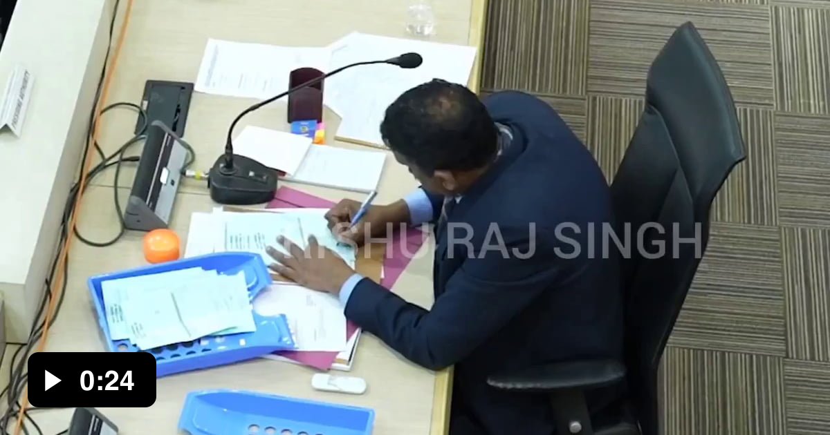 Election officer tampering with votes realizes that there's a CCTV camera right above him