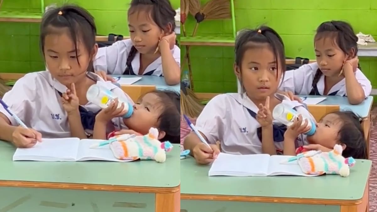 10-Year-Old Thai Student Praised For Feeding Baby Sister While Attending Class