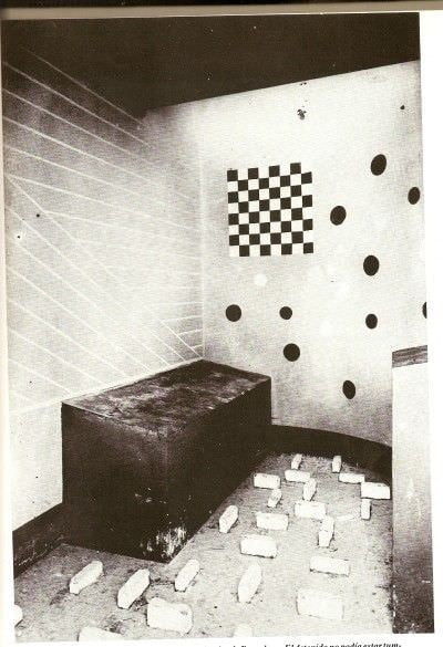 During the Spanish Civil War, French architect surrealist painter Alphonse Laurencic designed holding cells for the Spanish government. He built beds in such a manner that the prisoners would roll off them, and placed obstacles on the floor making it impossible to sleep