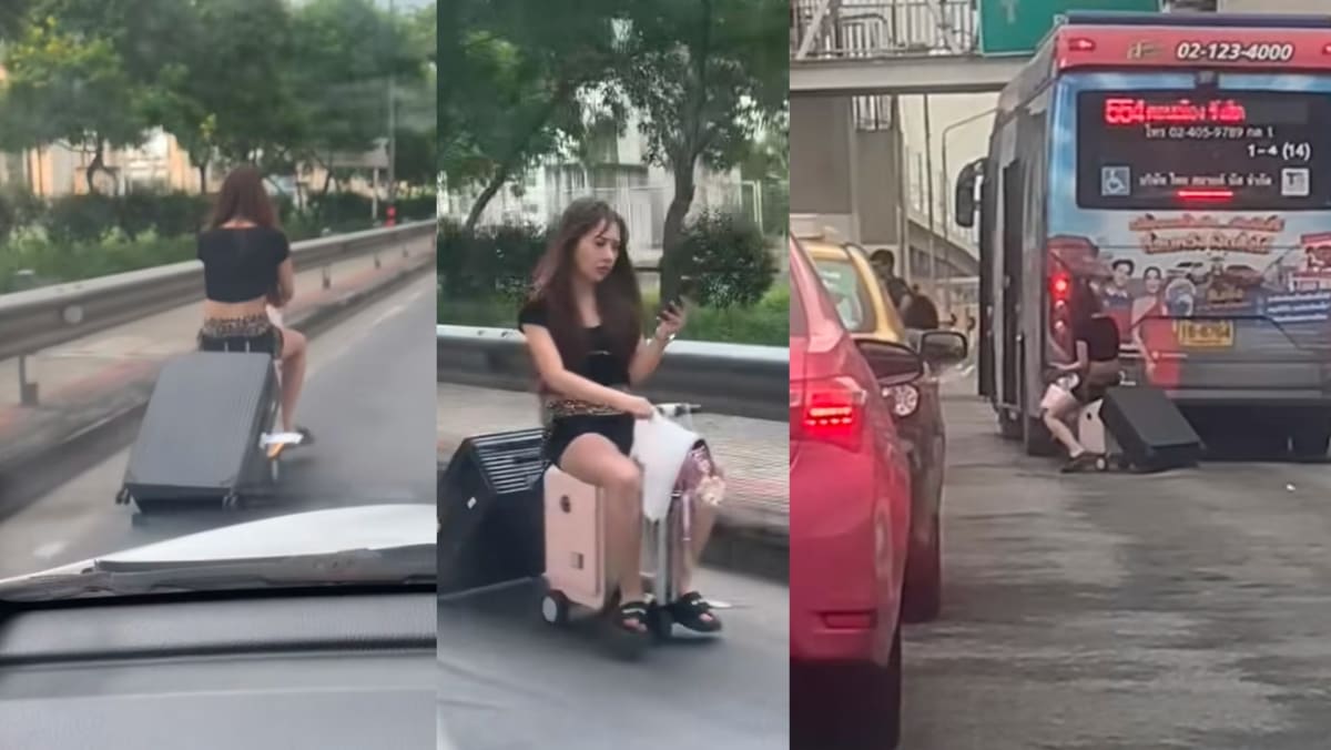 Woman In BKK Rides Motorised Luggage On The Road To Airport