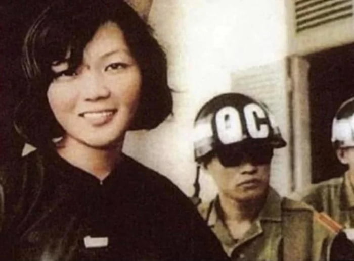 V\u00f5 Thi Thang smiling after being sentenced to 20 years hard labour in a prison camp by the South Vietnamese govt. After being sentenced she reportedly smiled at the judge and said `20 years? Your government won't last that long