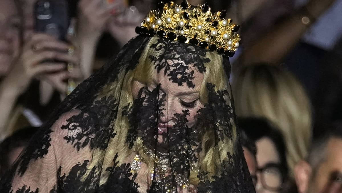 Madonna appears at Dolce & Gabbana show in black veil