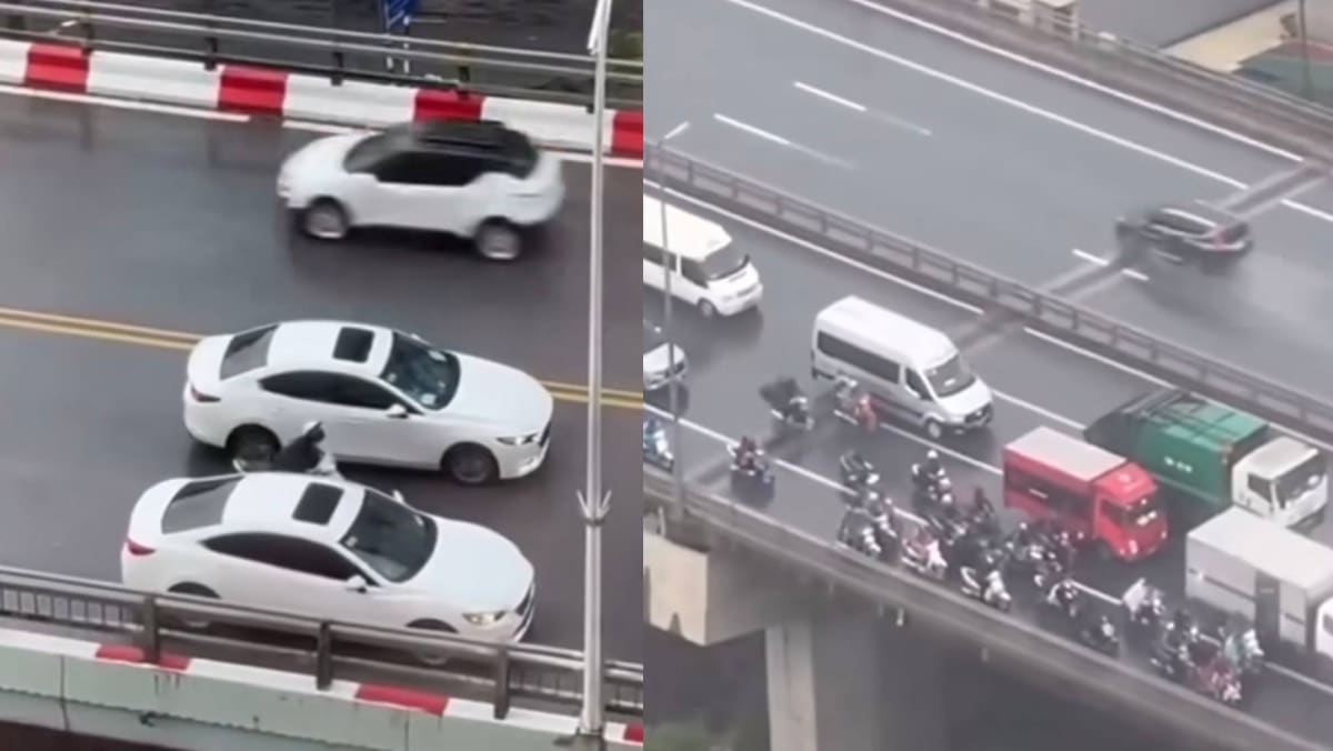 Vietnam Drivers Form Barricade Around Motorcyclists To Protect Them From Typhoon Yagi Winds