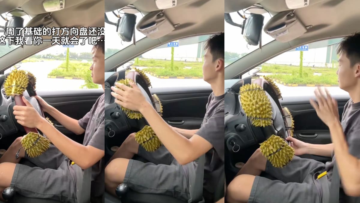 Driving Instructor Ties Durian Husks To Steering Wheel To Teach Student How To Drive