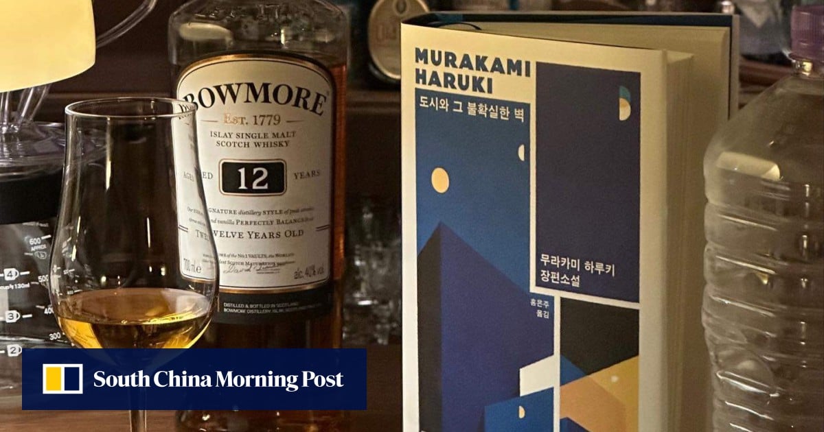 Koreans read books while sipping cocktails at a bar in Seoul, hip to the ‘text hip’ trend