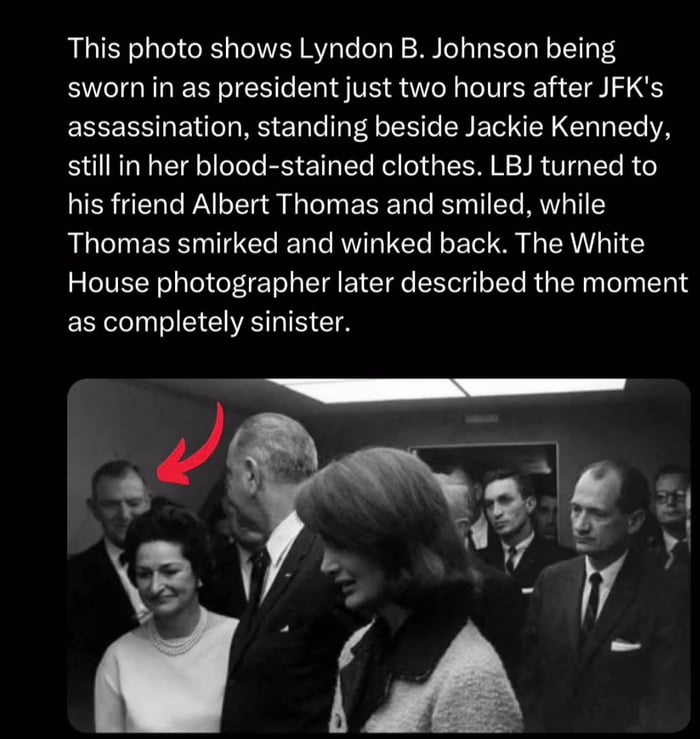 Lyndon B Johnson smiling at Albert Thomas while being sworn in as president just 2 hours after the assassination of JFK.