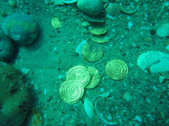 CAN THERE BE ANYTHING MORE EXCITING THAN FINDING GOLD COINS UNDER THE OCEAN? One thousand years under salt water does nothing to this noble metal.